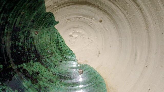 Detail of a bowl, plate, pottery, glazed, natural, raw. Unique ceramics made in Tamgroute, Morocco.