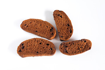Slices of brown bread with sweet chocolate on white.