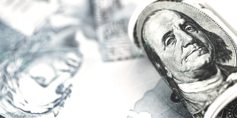 100 US dollar banknote over many Brazilian hundred dollar bills, a concept of high dollar against the Brazilian currency