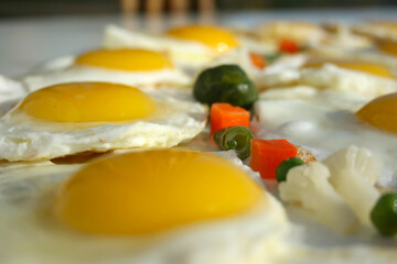Sparkling fried eggs with vegetables. Beautiful healthy food. 