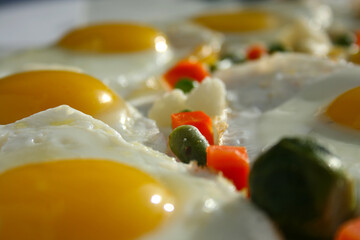 Sparkling fried eggs with vegetables. Beautiful healthy food. 