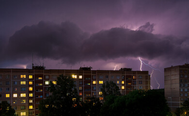 Thunderstorm lightning over houses