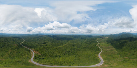 360 panorama by 180 degrees angle seamless panorama of aerial view of cars driving on curved, zigzag curve road or street on mountain hill with green natural forest trees in rural area of Nan,Thailand