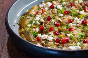 vegetarian dish made with organic veggies, cheese and pomegranate seeds