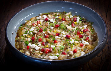 vegetarian dish made with organic veggies, cheese and pomegranate seeds