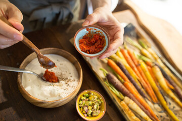 chef preparing a meal with curry and veggies