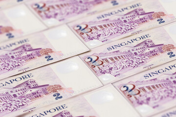 Fototapeta na wymiar Singapore money. Singapore dollar banknotes. 2 SGD dollars bills.