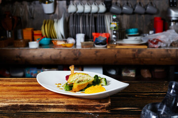 Kiev cutlet on a plate on the background of the kitchen