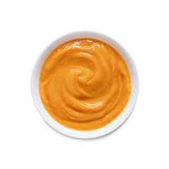 Pumpkin puree in a white plate, isolated on a white background. Top view,