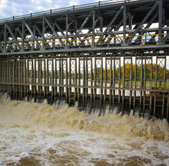 Dam on the river to create water power energy