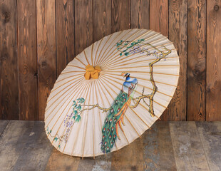 chinese paper umbrella on wooden background