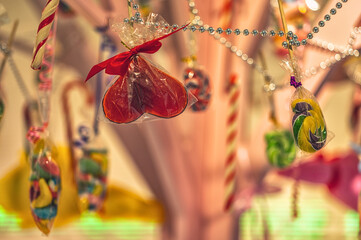 Colorful candies and sweets are hung as decorations.