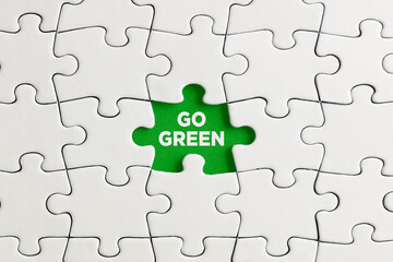 Green missing puzzle piece with the word go green.