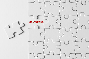 Contact us message written on missing puzzle piece