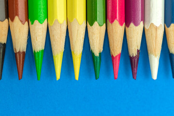 Close-up to sharp colour pencils, macro photography, blue background photo