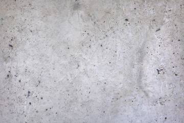 Obraz premium Old grey interior concrete wall, rough texture. Aged grungy with scratch and dirty spots on surface, industrial architecture loft style concept. Abstract material background, monochrome.