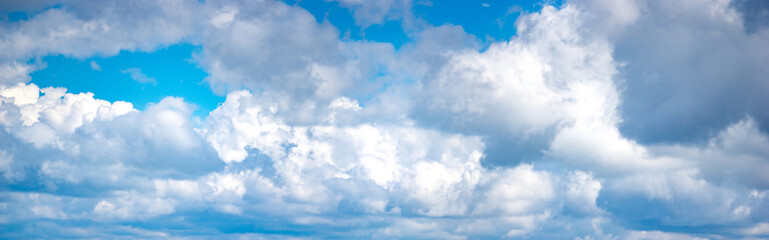 White clouds in the blue sky in summer