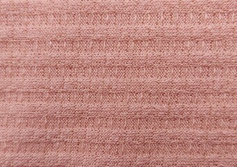 thick peach-colored cotton fabric, shot close-up from above
