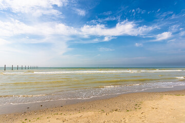 Empty seaside at Nieuwpoort in Belgium on beautiful summer day with blue sky