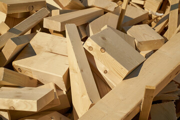 Remains of building material made of wood on the storage yard for processing in a pellet plant in the north of the city of Magdeburg in Germany