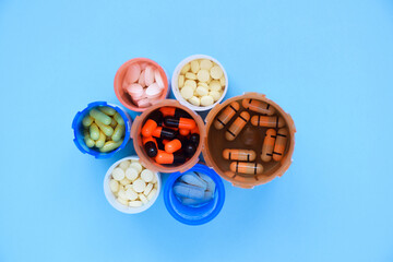 Variety of prescription medication on blue background