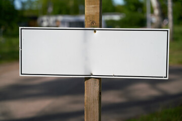 blank white sign with text space on the roadside