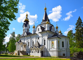 Grebnevskaya tent church in pseudo-Russian style with a tent bell tower was built in 2015 on the site of a wooden church that burned down in 2007. The architect is unknown. Moscow, Russia, May 2021.