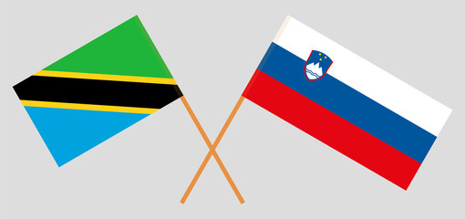 Crossed flags of Tanzania and Slovenia. Official colors. Correct proportion