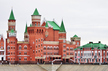 Obraz premium A red brick chapel decorated with white brick in honor of Saints Peter and Fevronia. Russia Yoshkar-Ola 01.05.2021. High quality photo