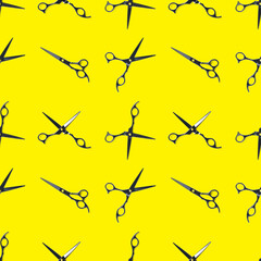 Seamless pattern of black scissors. professional hairdresser black scissors isolated on yellow....