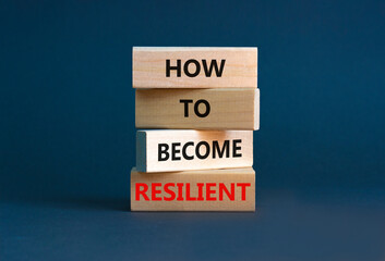 How to become resilient symbol. Concept words 'How to become resilient' on wooden blocks on a beautiful grey background. Businessman hand. Business, How to become resilient concept.