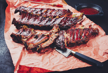 Barbecue pork spare loin ribs St Louis cut with hot honey chili marinade served as close-up on...
