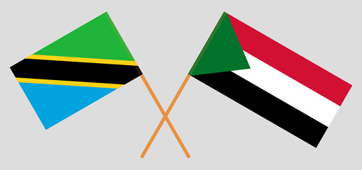 Crossed flags of Tanzania and the Sudan. Official colors. Correct proportion