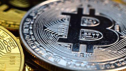 Close up of silver bitcoin coins.