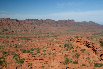 Prehistoric cliffs in Sierra de las Quijadas National Park. Arid desert landscape. Red sandstone, hills, canyon and valley view.