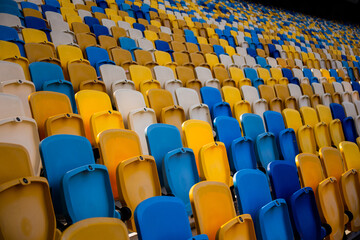 Fototapeta premium Empty rows of seats in a football olympic stadium