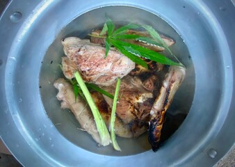Asian-style flavored pork leg soup made from hemp leaves
