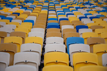 Fototapeta premium Empty rows of seats in a football olympic stadium