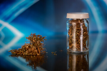 bottle of medical cannabis. alternative medicine. medical marijuana in glass jar

