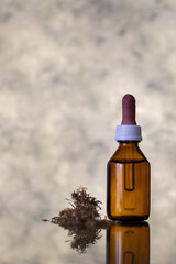 glass dropper with cannabis oil. alternative medicine. medical cannabis. marijuana bud