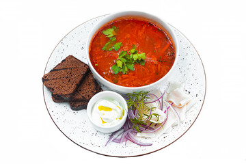 Borsch with croutons, sour cream and onions.