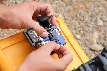 A communications technician checks the data line connection. Cable Technology Fiber Optic Fusion Splicing Internet Signal 