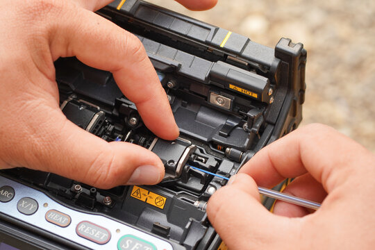Communication system technician checks the data line connection Cable technology Fiber Optic Fusion Splicing Internet Signal and Cabling with Fiber Optic Fusion Splicing Machine Fiber Optic Splicing M