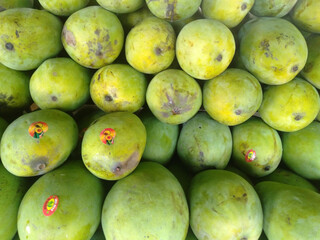 Pile of mangoes for sale at the traditional market