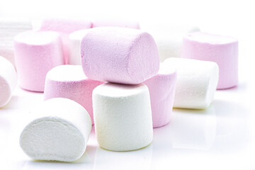 Heap of delicious White and pink marshmallows, isolated on white background
