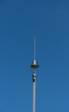 lightning rod on pole, blue sky background,
