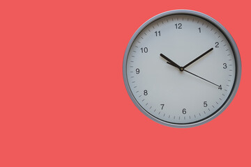 Wall clock red background. The concept of 