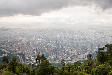 Fototapeta na wymiar View from the top of Mount Monserrate in Bogota, Colombia. Storm clouds and skyline.