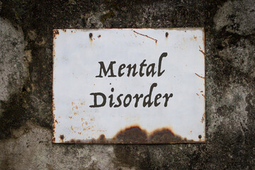 Mental disorder, words on a grunge metal board on wall.