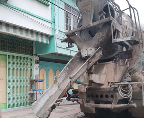A truck mixer  is pouring concrete on a construction project in Serdang Bedagai, Indonesia on November 15, 2019.